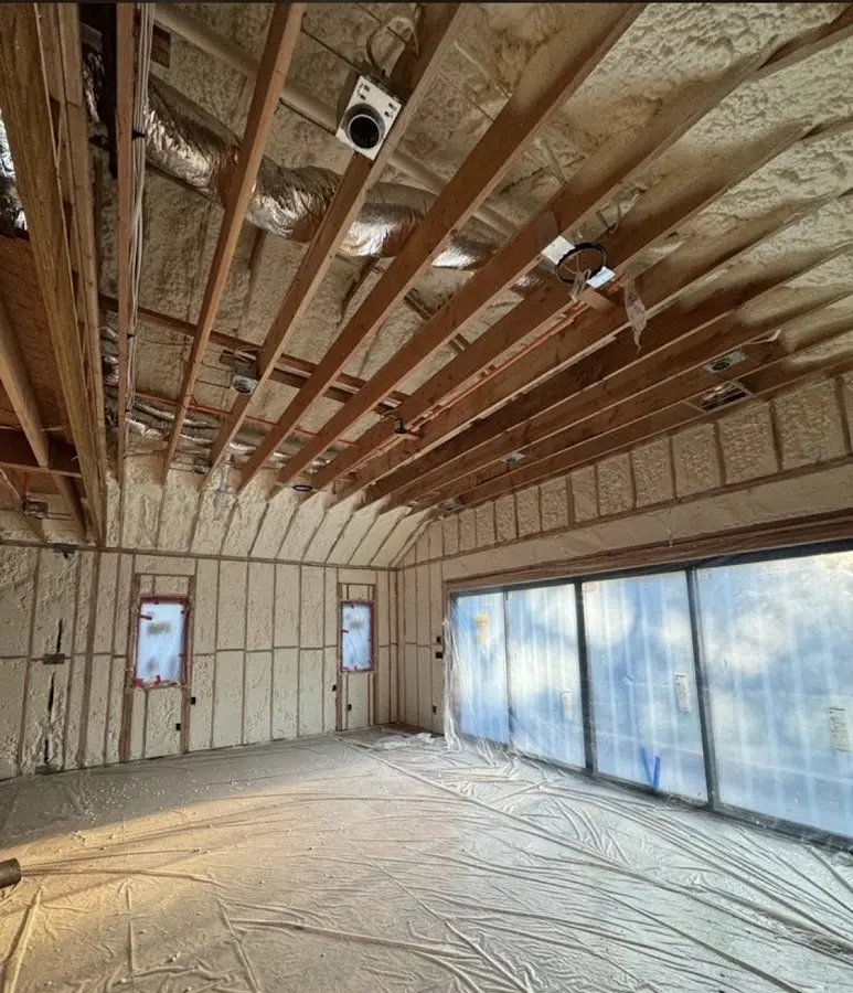 Interior walls and ceiling insulated with spray foam during new construction in Oak Island